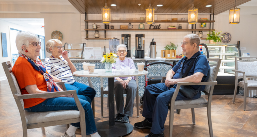 group of people sitting in the coffee bar at omaha's parsons house assisted living