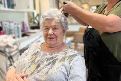 a dementia patient receiving a salon treatment